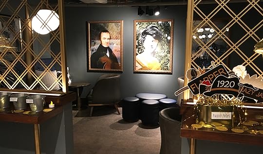 A room in a hidden speakeasy and 1920's photo props for guests to use during the party.