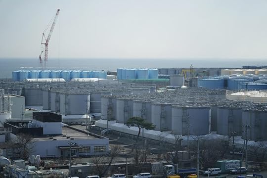 Tanks storing treated radioactive water after it was used to cool the melted fuel are seen at the Fukushima Daiichi nuclear power plant, run by Tokyo Electric Power Company Holdings (TEPCO), in Okuma town, northeastern Japan, Thursday, March 3, 2022. The government has announced plans to release the water after treatment and dilution to well below the legally releasable levels through a planned undersea tunnel at a site about 1 kilometer offshore. (AP Photo/Hiro Komae)