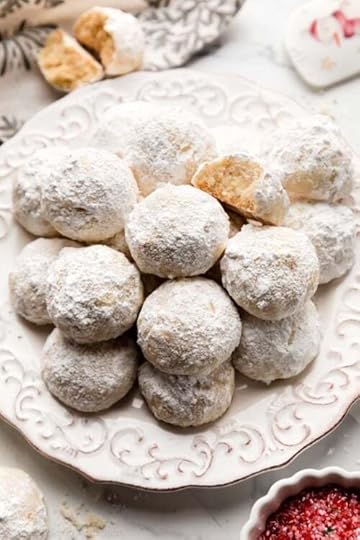 snowball cookies on white plate.