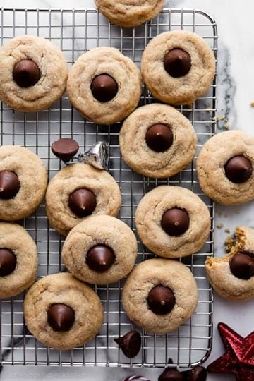 peanut butter blossoms Christmas cookies on cooling rack.