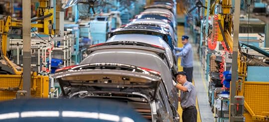 Employees work on the production line of Haima 7X-E electric vehicle at Haima Automobile Haikou Base in China. Photo: Getty Images