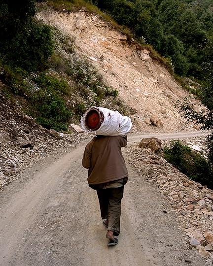 Ashish Shah, <em>A man walking to Baluni Village with a gas gylinder</em>, 2022″>		</div>		<div class=