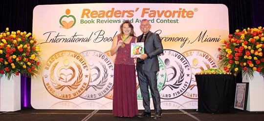 author Kathleen shields on stage receiving silver medal book award readers favorite Miami Florida 2022