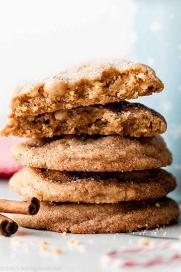 stack of peanut butter snickerdoodle cookies with blue snowflake mug behind it.