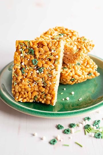 caramelized white chocolate Rice Krispie treat squares with green and white sprinkles