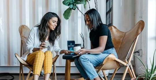 Coworkers who are friends at work talking