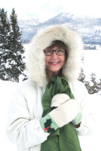 My Christmas Letter, Author Elinor Florence stands beside Lake Windermere, December 2022