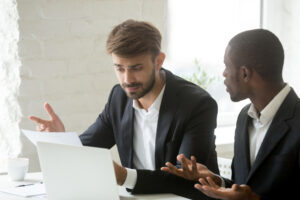 Two colleagues talking, one is complaining