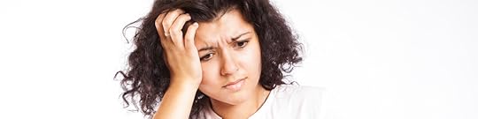 Confused woman stares at book - Redditor Does the Math – Proves AI Writers Suck