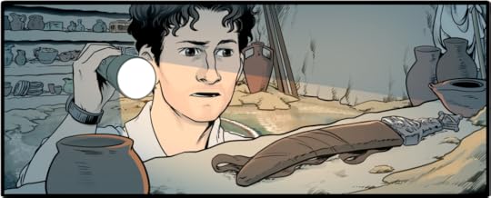 Ben Mortara shines a flashlight at an ancient dagger inside a newly-discovered ancient tomb.