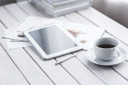 Tablet and a cup of coffee