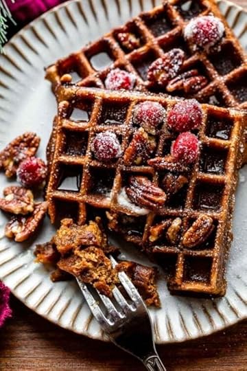 fork removing bite of gingerbread waffles.