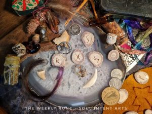 The Weekly Runecast for 18 December 2022 and 1 January 2023 with the runes Jera, Eihwaz, Gebo, and Raidho carved into reindeer antler slices, with a myriad combo of elements on a geode slab background.