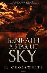 A man looking over a mountain lake with clouds with a red cast to the sky. JL Crosswhite. Beneath a Star-Lit Sky