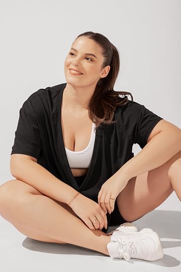 popflex daring deep v black layered over a white sports bra
