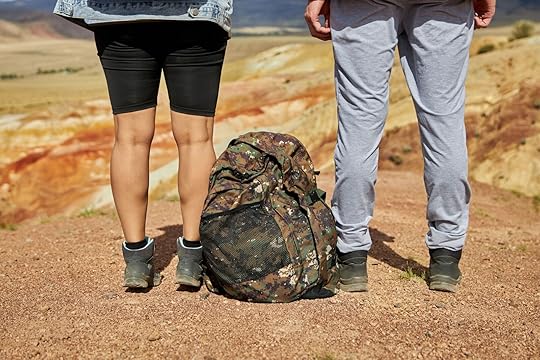 Woman in woman's hiking shorts and woman in pants
