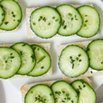 overhead shot of open faced cucumber sandwiches.