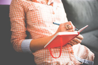 Women writing in journal