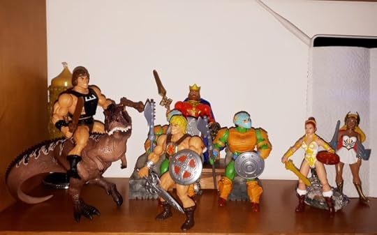 He-Man talks to Wun-Dar, while King Randor, Teela, She-Ra and two guards look on.