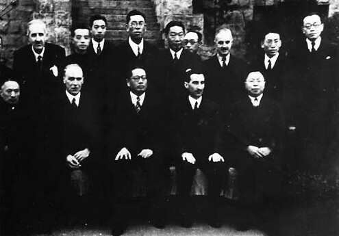 Chinese and British officials after the signing of the Sino-British Treaty for Relinquishment of Extra-Territorial Rights in China, Chongqing, China, 11 Jan 1943; Front row from left: Wellington Koo, Horace James Seymour, T.V. Soong, Hugh Edward Richardson, Wu Guozhen (public domain via Wikipedia)