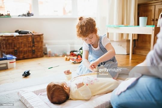 Big sister MinhonTT changes clothes and diaper for little brother.