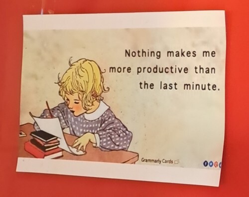 postcard of girl writing with caption