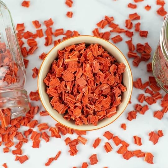 Dehydrated cubed carrots in a small round bowl.