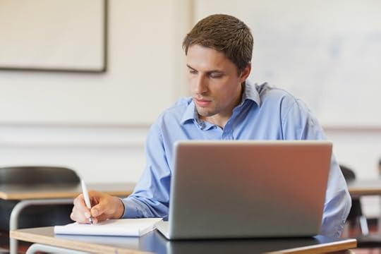 Male doctoral student working on his dissertation thesis 