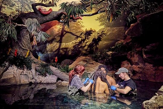 Exhibit cleaners fixing Eve's hair