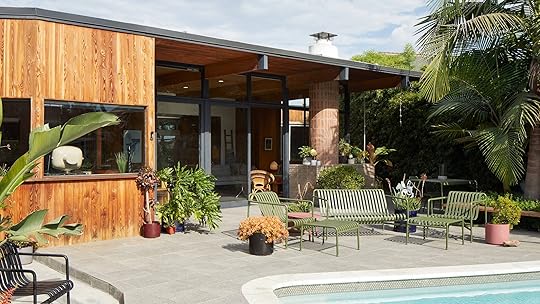 The backyard patio of this midcenturymodern LA house features a bustling community of plants.