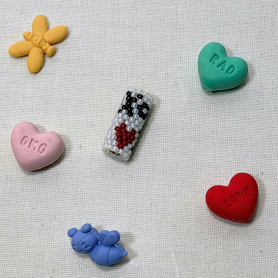 beaded peyote bead with hearts and xo symbol