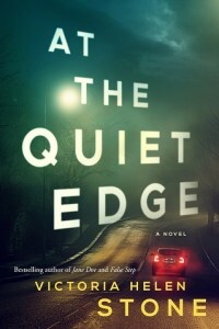 The cover for At the Quiet Edge by Victoria Helen Stone. A cloudy night sky is lit from below by a solitary streetlight. A car drives away from us down a lonely highway, the brake lights are lit up in red.