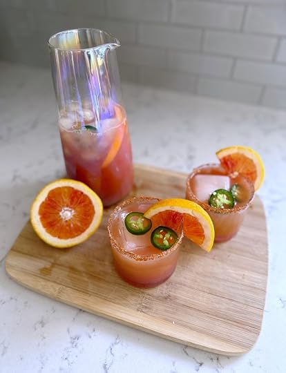 spicy blood orange margarita mocktail in cravings iridescent carafe and glasses valentine's day mocktail