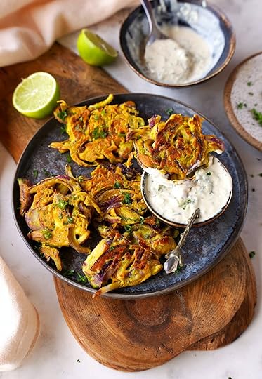 bhaji with raita yogurt sauce on plate