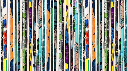 A colourful stack of the spines of lots of comic books pressed together.