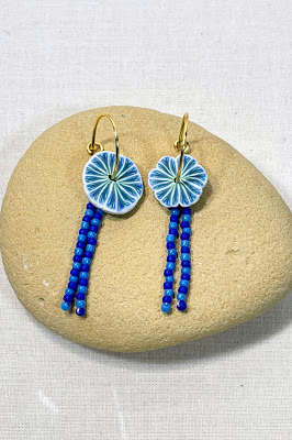 Polymer clay flowers disks on thin wire hoops with bead fringe