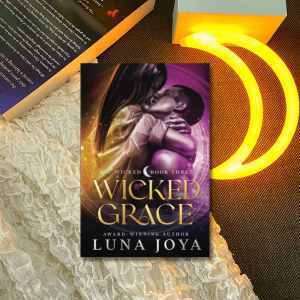 Picture of Wicked Grace book with a book to the top left and a glowing