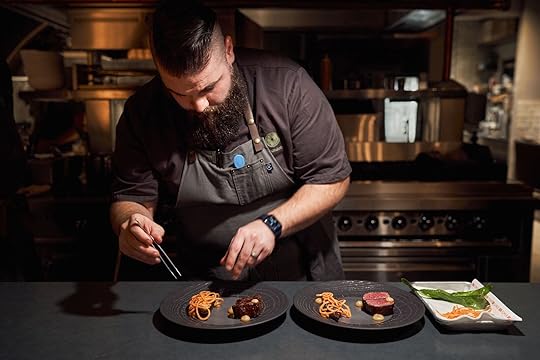 chef brandon at the green-o in montana plating food
