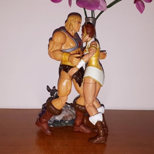 He-Man and Teela are kissing.
