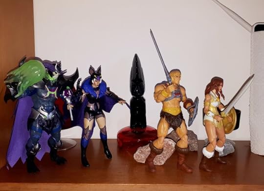 He-Man and Teela escape, while Skeletor and Evil-Lyn fire magic blasts after them.