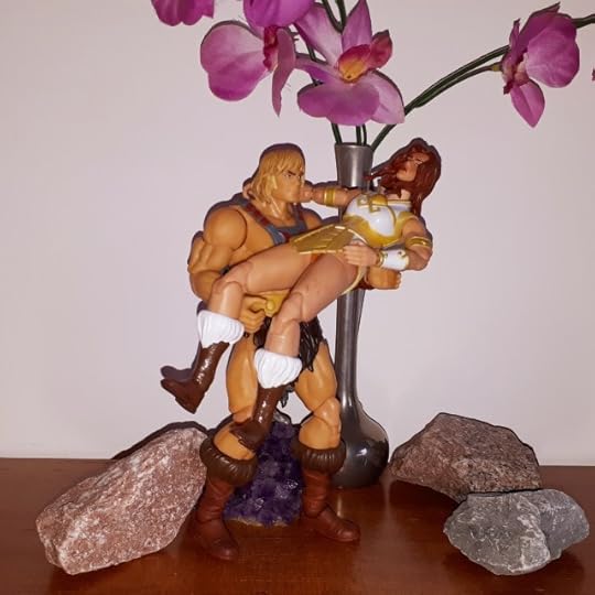 He-Man carries Teela.