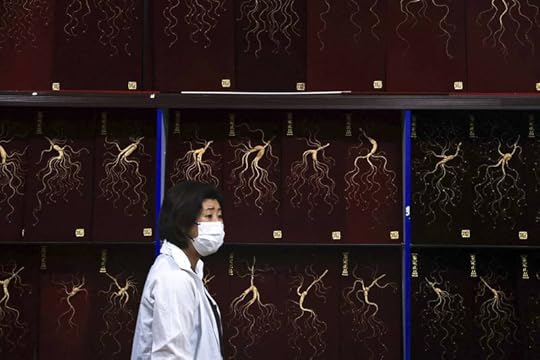 A person walks past a ginseng trading market in Baishan in China's Jilin province in 2021. A Chinese official last month encouraged people to take ginseng for severe COVID-19.