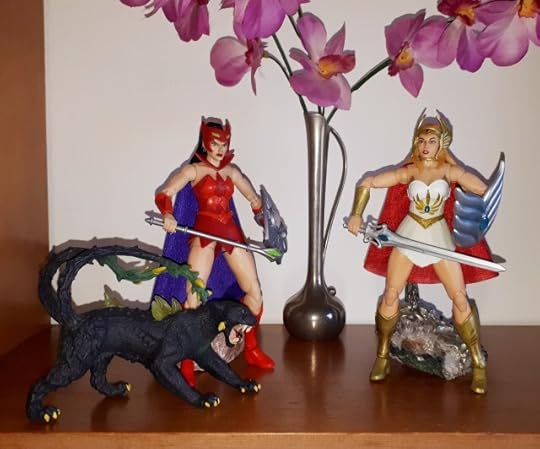 Catra and She-Ra both lower their weapons.
