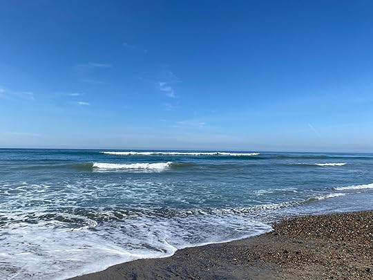 Moonligh Beach at Encinitas with small waves under blue sky