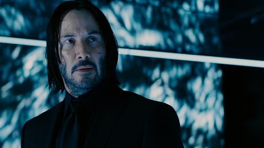 Keanu Reeves in a black suit and shirt in Chapter 3- Parabellum