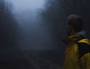 man walking in darkness