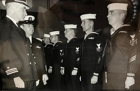 Navy Lieutenant Commander inspecting sailors