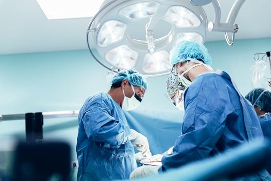 Team of Surgeons Operating in the Hospital.