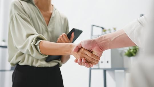 freelancer connecting with a real prospect and shaking hands