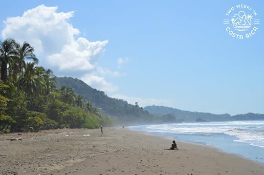 dominical beach with green mountains behind